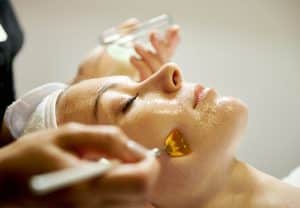 A woman getting a gentle peel from a Hollywood Facial in a medi spa in Calgary.