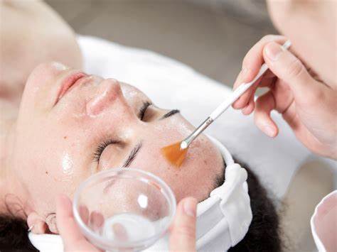 A woman getting a gentle peel brush on from a Hollywood Peel at a medi spa in Calgary.